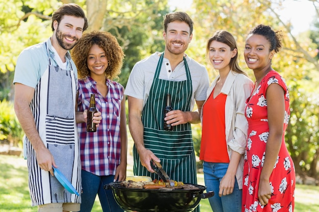 portrait happy friends preparing barbecue grill park 107420 37280